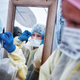 Medical workers putting on protective equipment at the beginning of their shift at the emergency field hospital run by Samaritan’s Purse and Mount Sinai Health System in Central Park on April 21, 2020 in New York City.